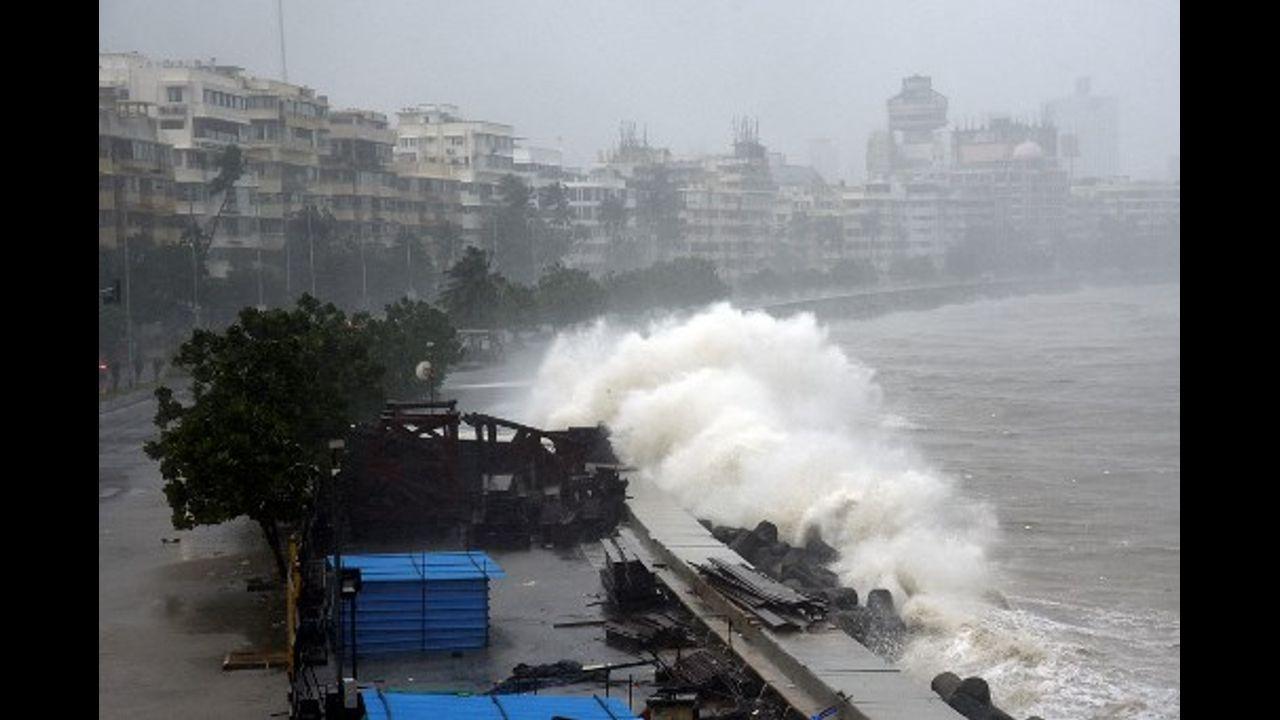 Waves lash over onto a shoreline in Mumbai. Pic/AFP